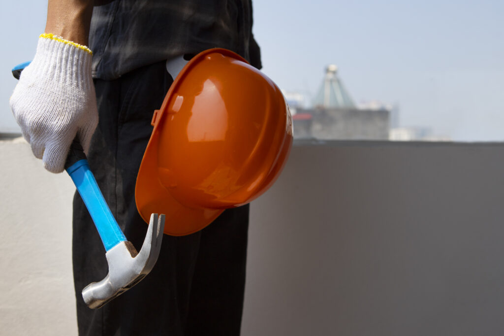 Construction Worker Using Hammer Job Site (1)